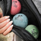 Fetch Boy Crossbody Ball Bag with Fetch Boy Rubber Balls Inside.