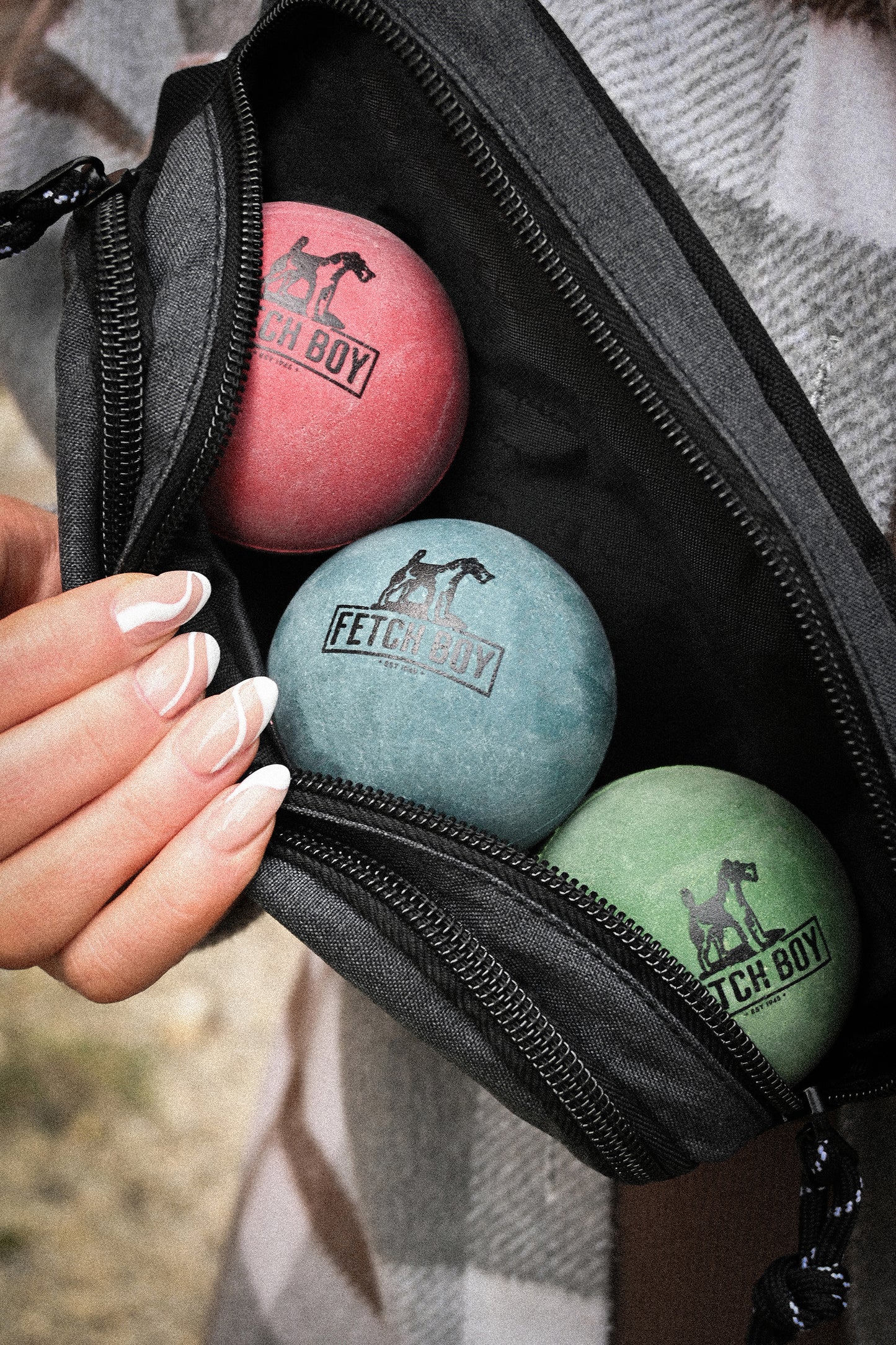 Fetch Boy Crossbody Ball Bag with Fetch Boy Rubber Balls Inside.