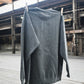 Fetch Boy Unisex Heavyweight Crewneck Sweatshirt in Steel Gray in Industrial Setting.