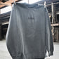 Fetch Boy Unisex Heavyweight Crewneck Sweatshirt in Steel Gray in Industrial Setting.