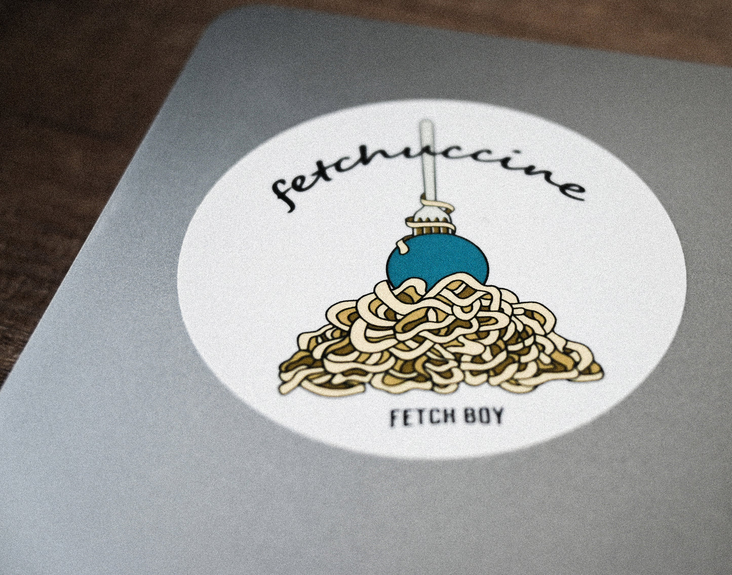 Fetch Boy Fetchuccine Funny Punny Matte Sticker of Pasta on Laptop.