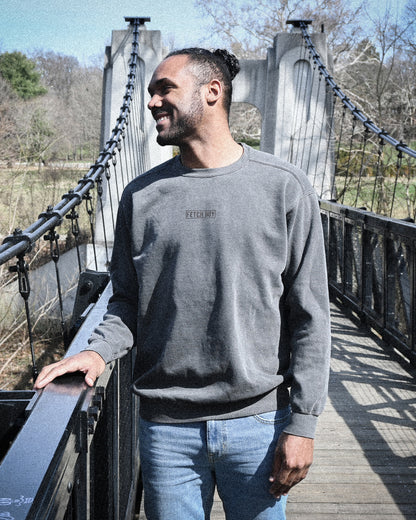 Fetch Boy Unisex Heavyweight Crewneck Sweatshirt on Bridge in Columbus Ohio.